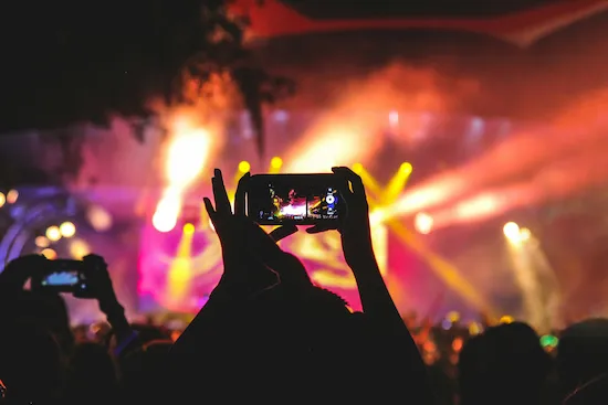 Someone recording an event on their phone