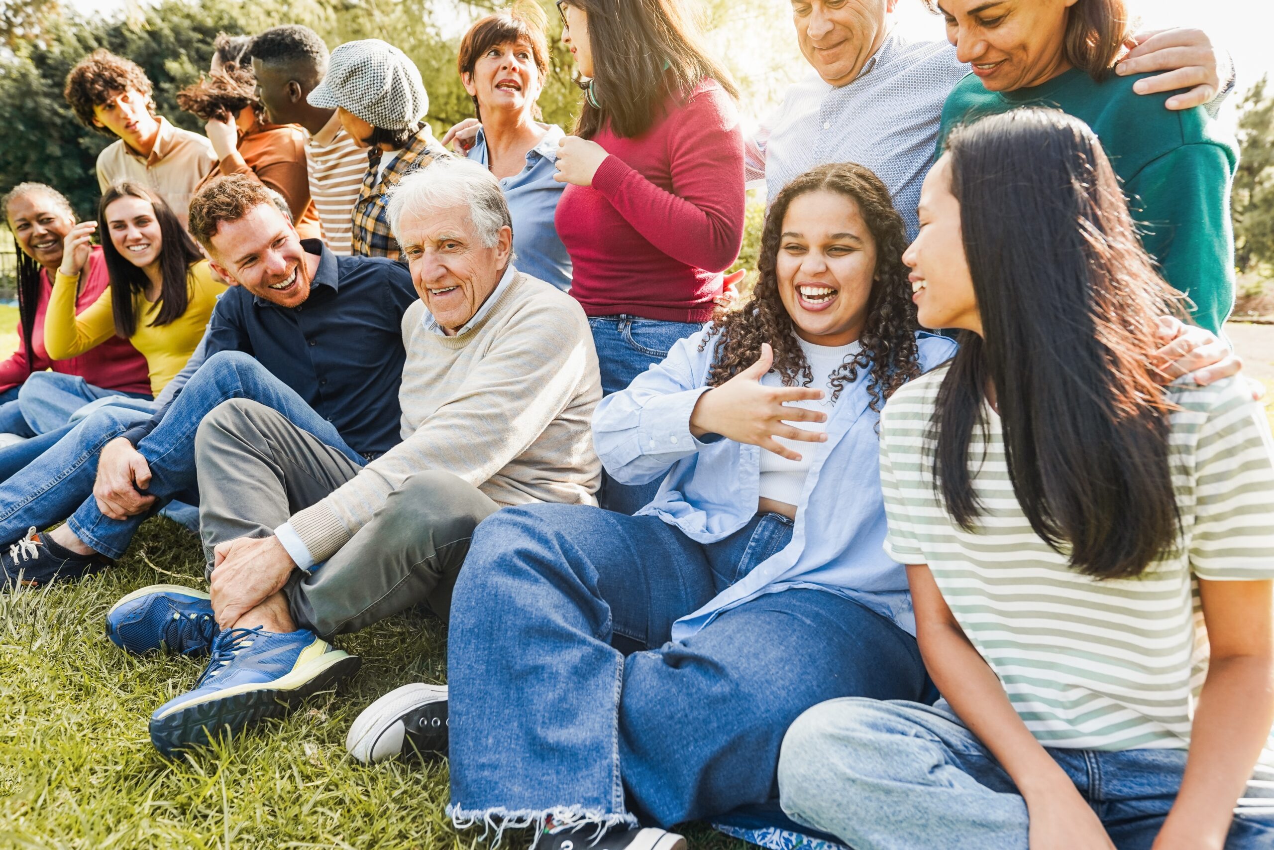 Group,Of,Multigenerational,People,Smiling,In,Front,Of,Camera,